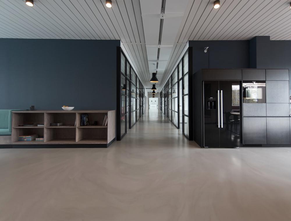 Spacious, well-maintained open office interior with clean polished floors