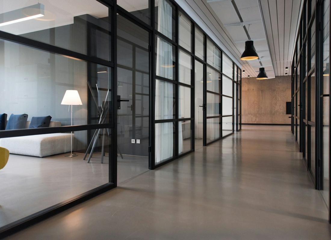 Clean, modern commercial office lobby with polished concrete floors and glass partitions