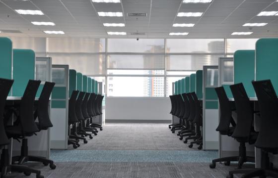 Tidy professional office workspace with cubicles and clean floors