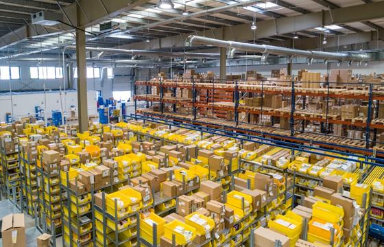 Organized industrial warehouse interior with shelving